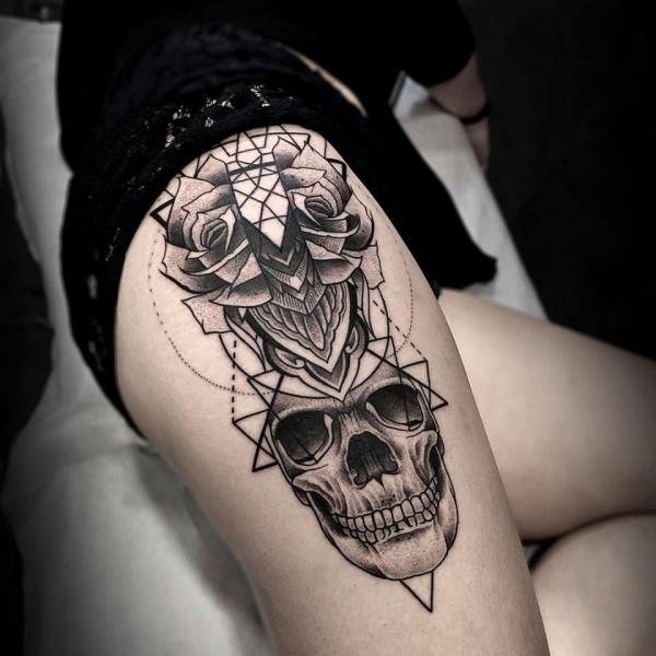 Geometric skull and flower tattoo design