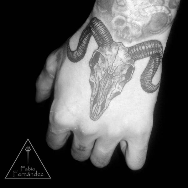Goat skull hand tattoo