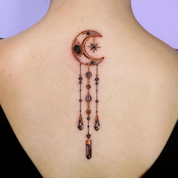 Golden crescent moon with pendant