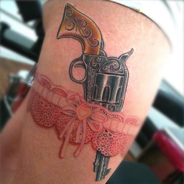 Gun and red lace garter tattoo