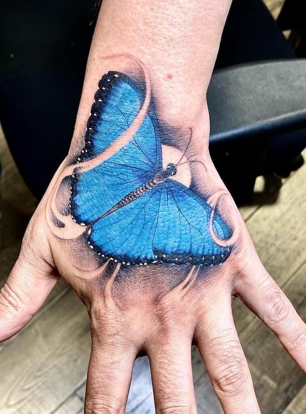 Blue Monarch Butterfly on Hand