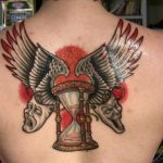 Hourglass with wings and skull