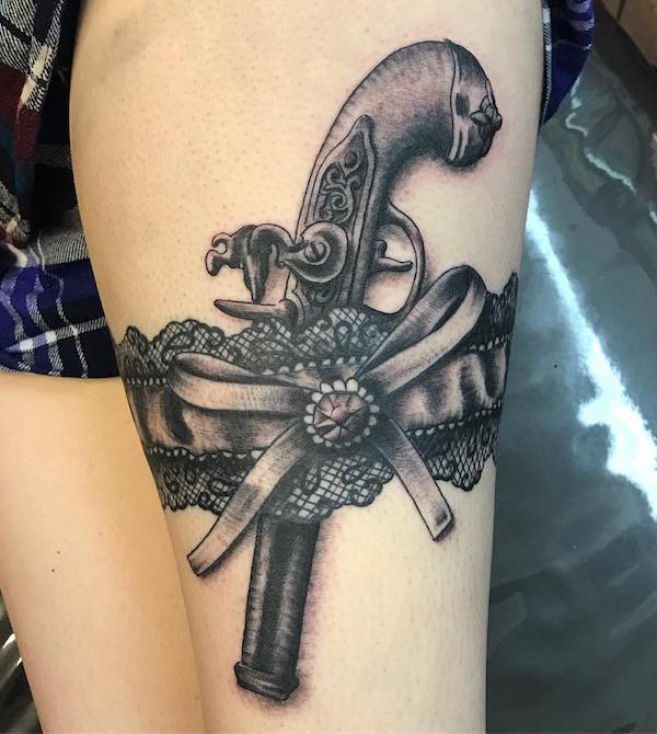 Lace and lace garter with bow and gun
