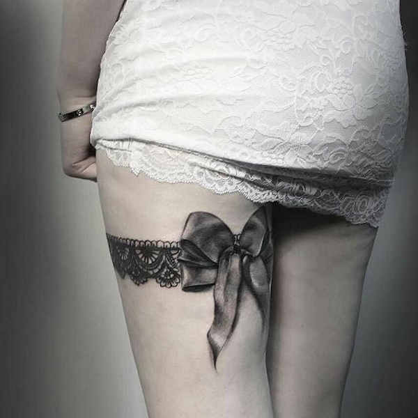 Lace garter with a realistic bow on the back of thigh