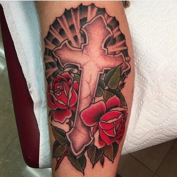 Negative space cross with halo and roses around it