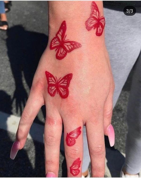 Red ink butterfly tattoo