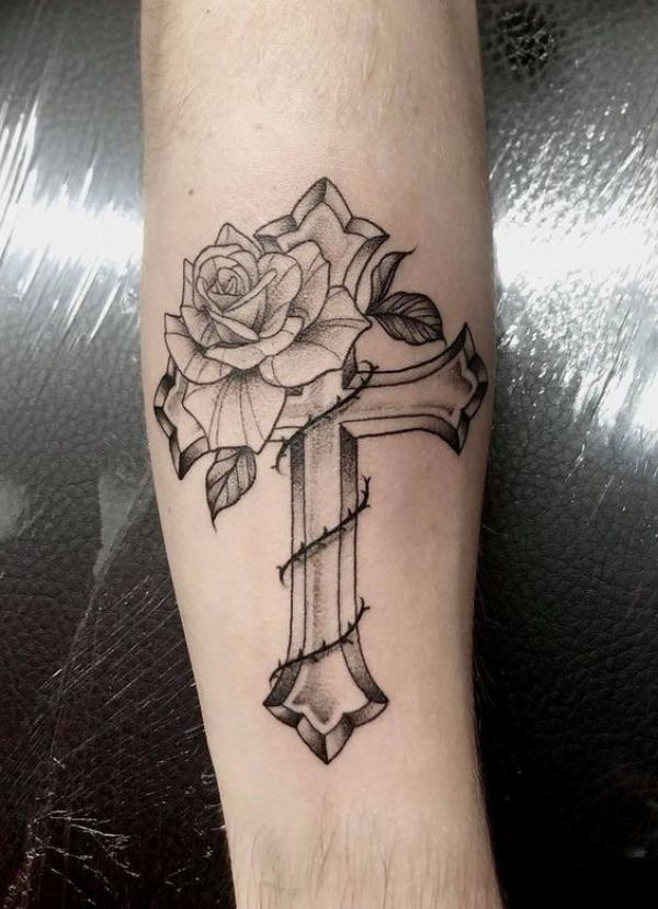 Rose and cross wrapped with thorns