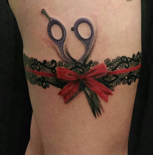 Scissors and ribbon garter tattoo
