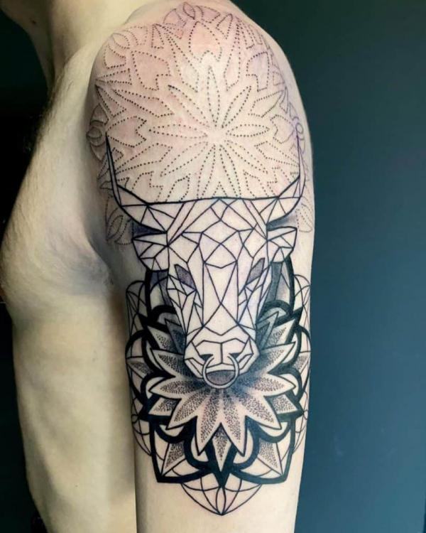 Stylized geometric Bull head surrounded with Mandala Patterns
