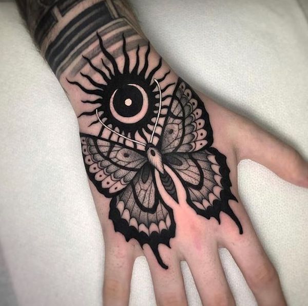 Tribal butterfly with sun and moon