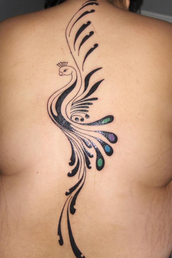 Tribal peacock back tattoo