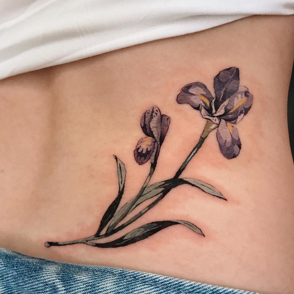 Vintage iris low back tattoo