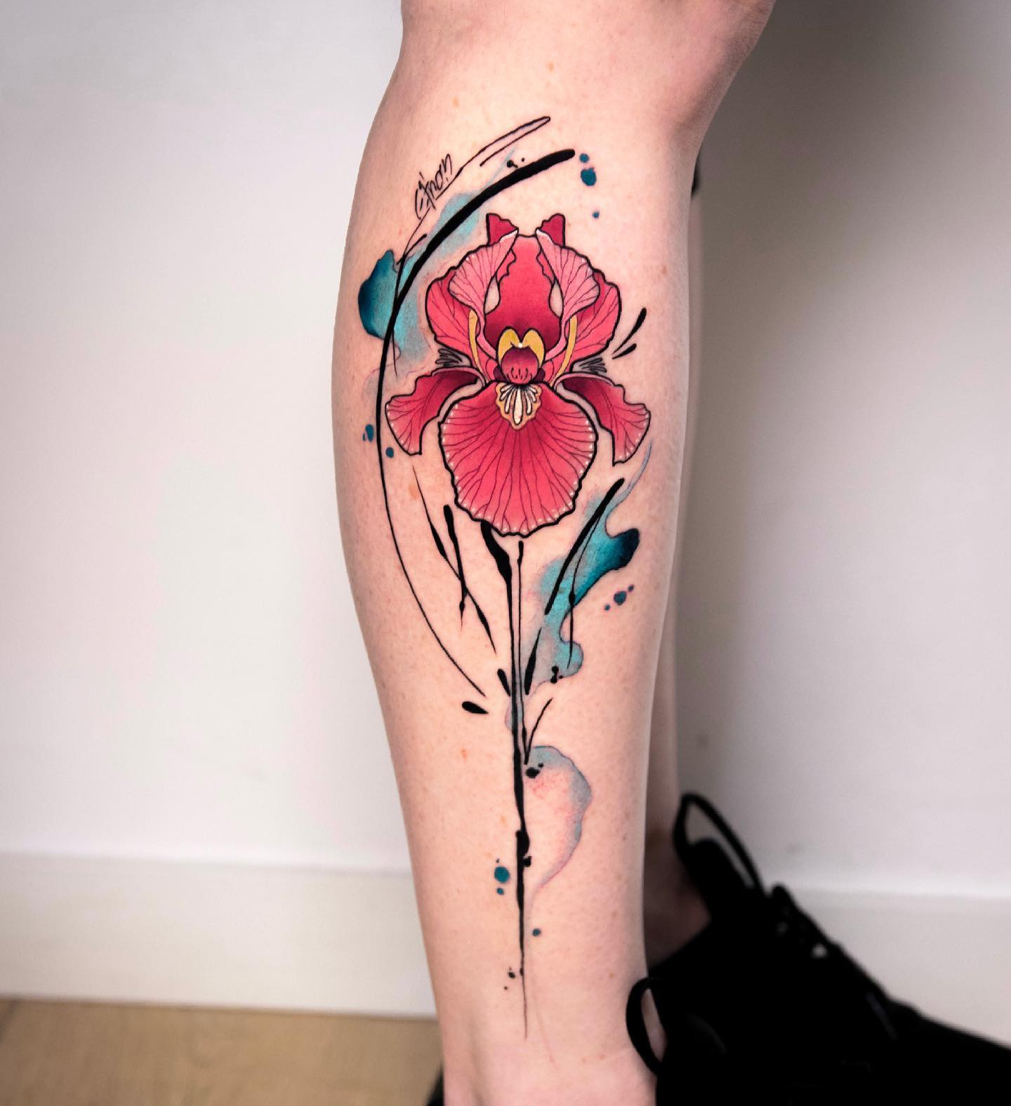 Watercolor iris forearm tattoo