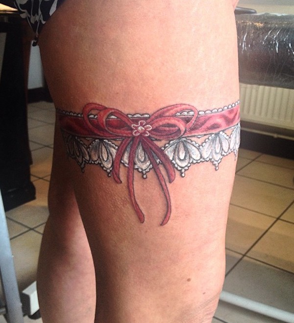 White lace with red ribbon