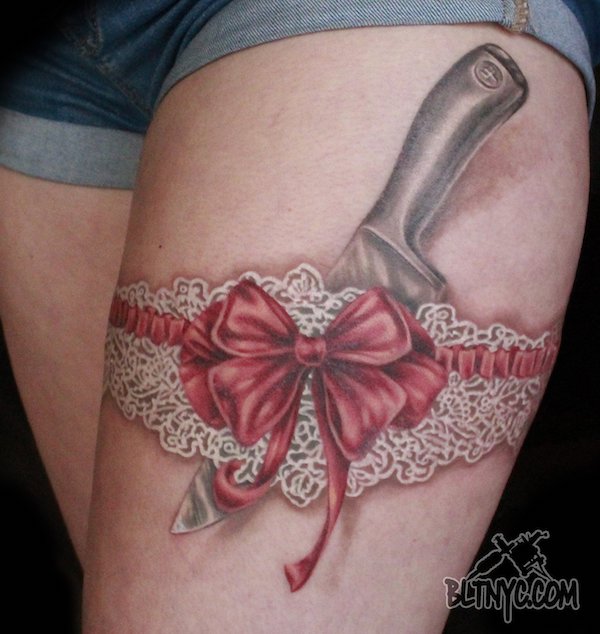 knife and White lace with red ribbon
