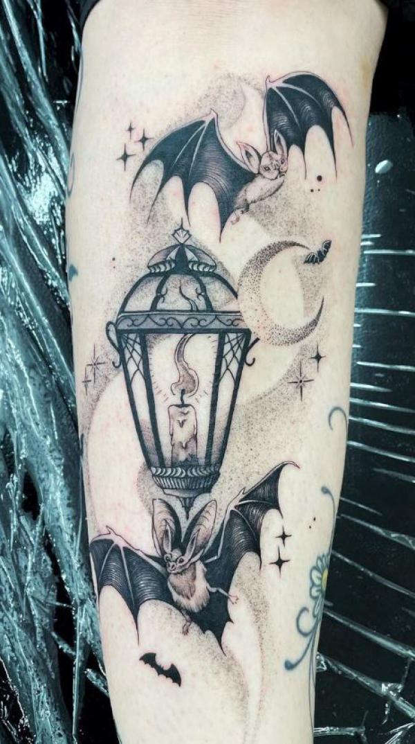 A lamp surrounded by bats and stars