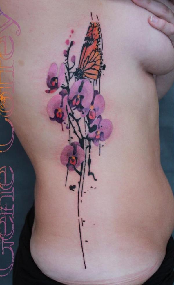 A monarch butterfly perched on orchid