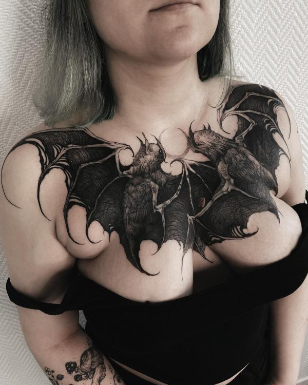 Bat chest tattoo female