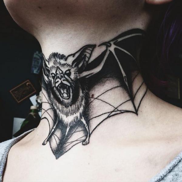 Bat throat tattoo