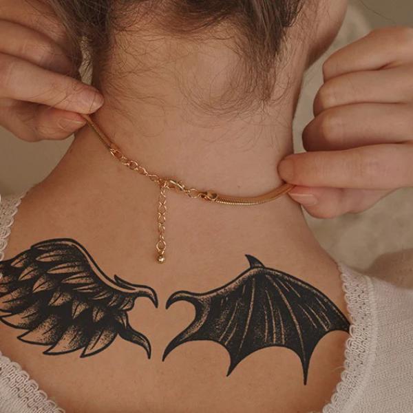 Bat wings tattoo