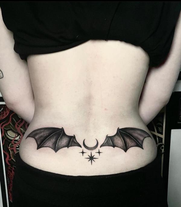 Bat wings with moon and stars tattoo