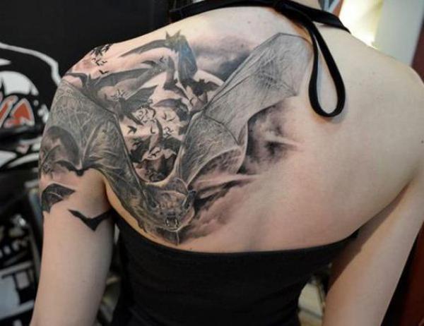 Black and grey bats tattoo