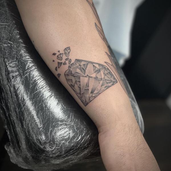 Black and grey broken diamond tattoo