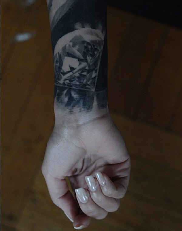 Black and grey diamond wrist tattoo