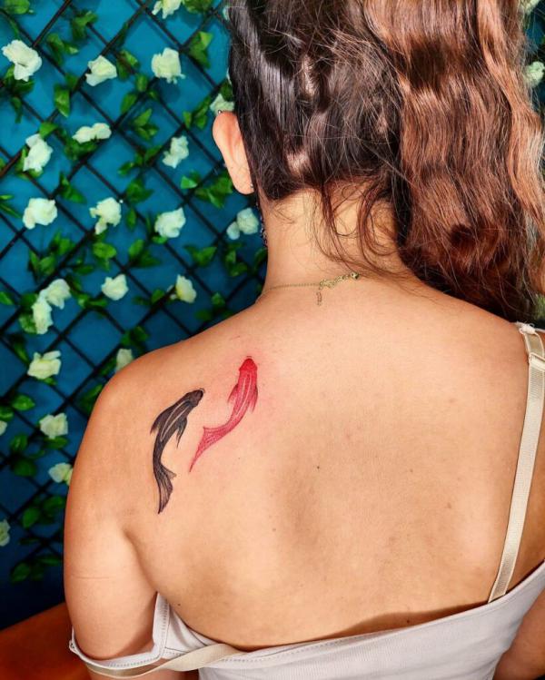 Black and red two koi fish tattoo
