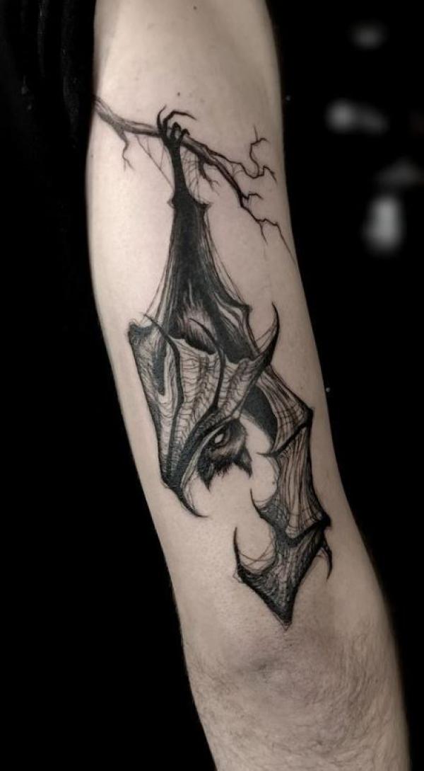 bat hanging upside down tattoo