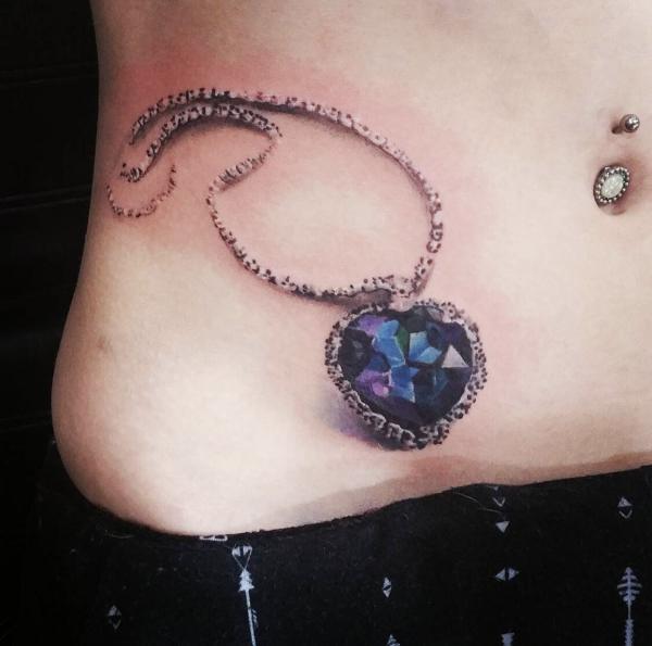 Diamond necklace tattoo
