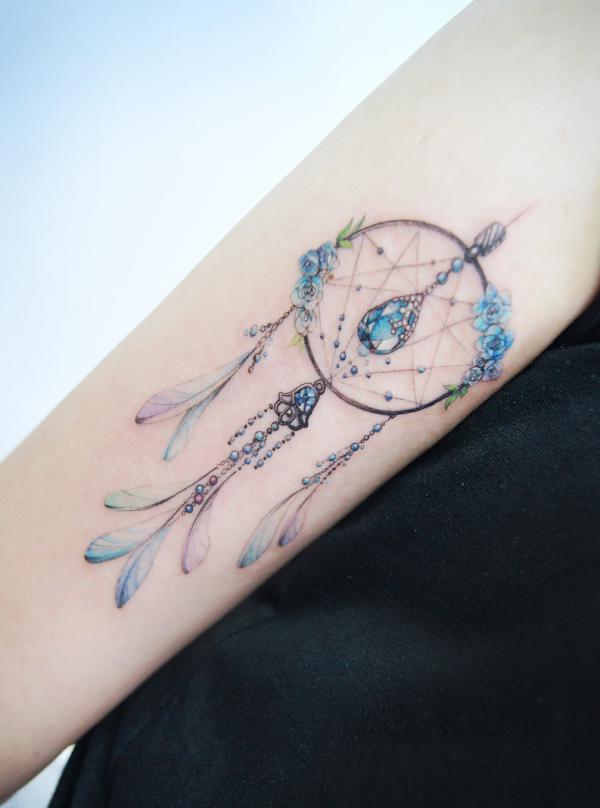 Dreamcatcher tattoo with diamonds