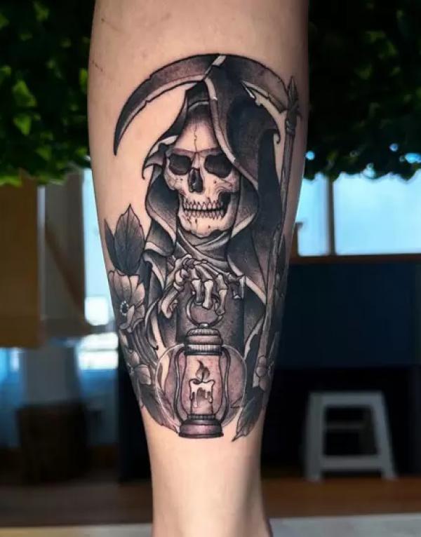 Grim reaper holding a lamp on fingers