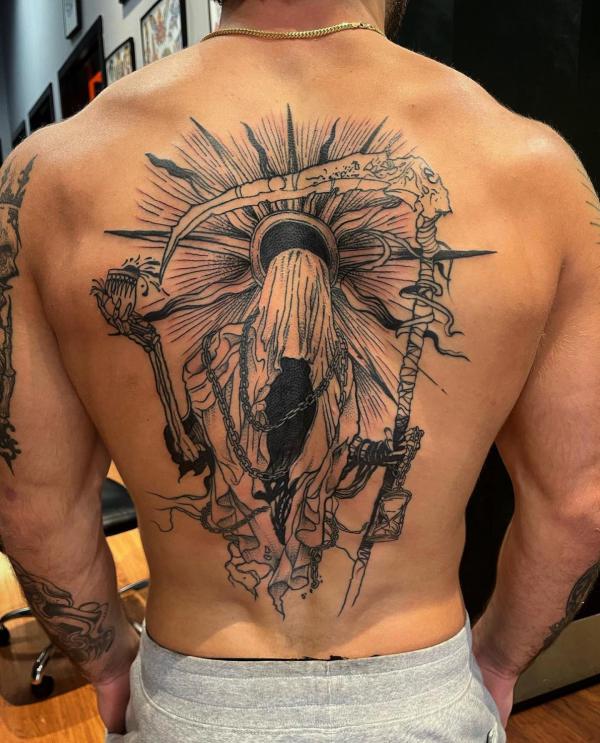 Grim reaper with chains walking to sun