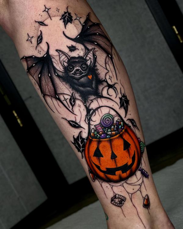 Halloween bat and jack o lantern tattoo