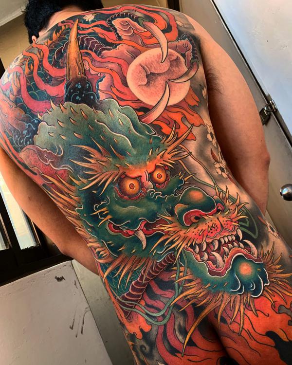 Japanese dragon and sun tattoo