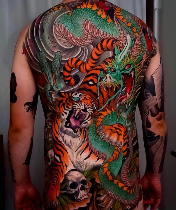 Japanese tiger and dragon full back tattoo