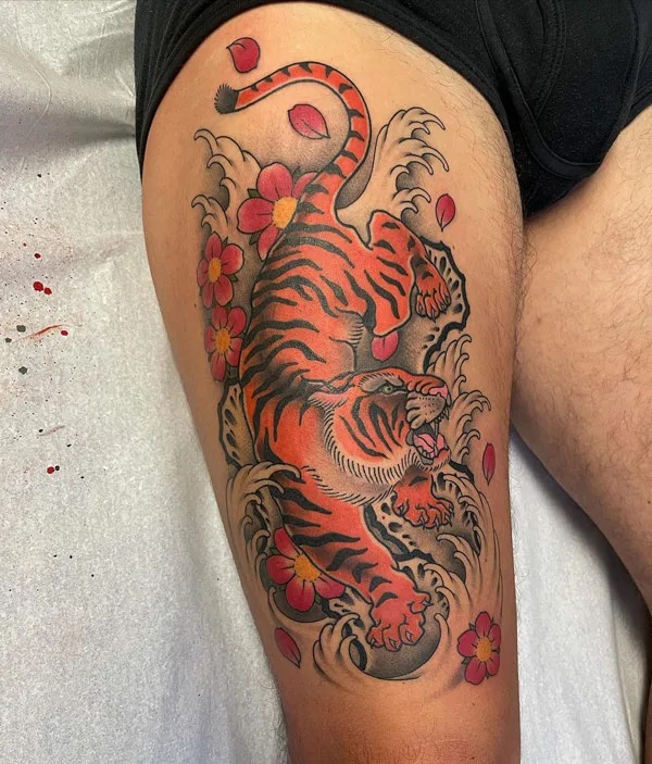 Japanese tiger and wave thigh tattoo
