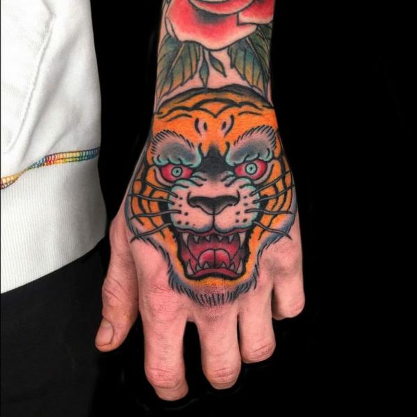 Japanese yellow tiger head hand tattoo