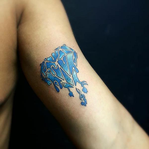 Melting blue diamond tattoo