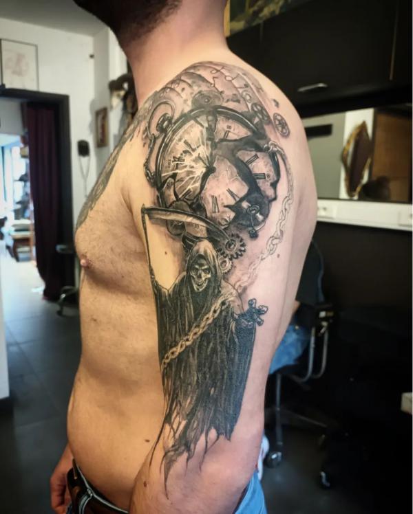 Pocket watch and grim reaper half sleeve tattoo