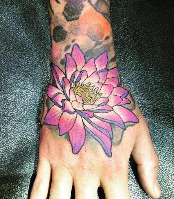 Purple water lily on the hand