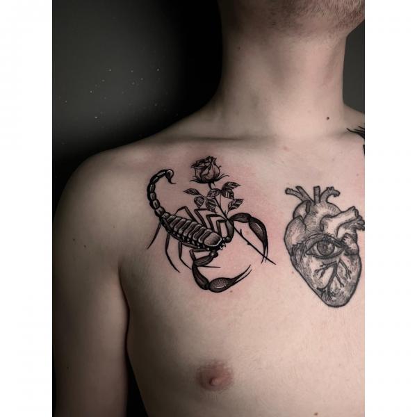 Scorpion with rose approaching the heart with an eye