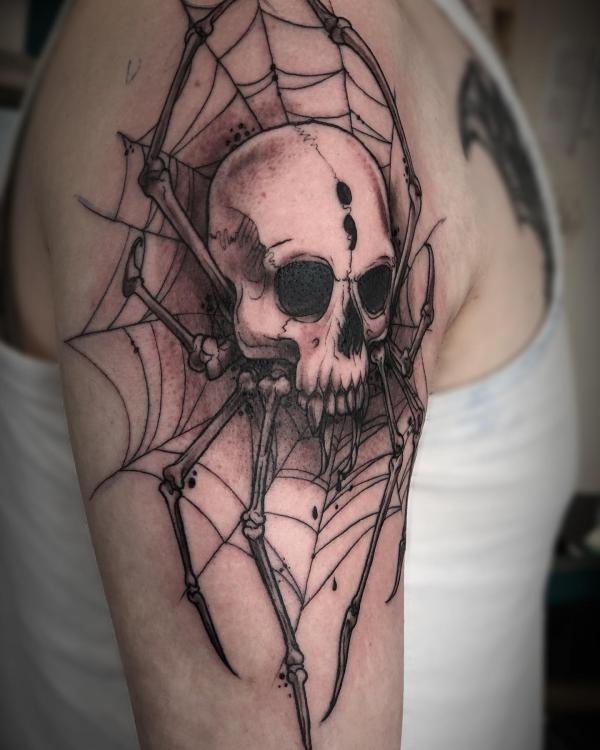 Spider web and spider skeleton tattoo