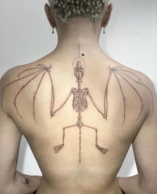 Symmetric bat skeleton back tattoo