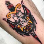 Traditional dagger through bat face tattoo