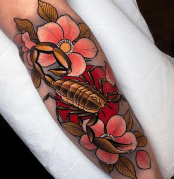 Traditional golden scorpion with flowers