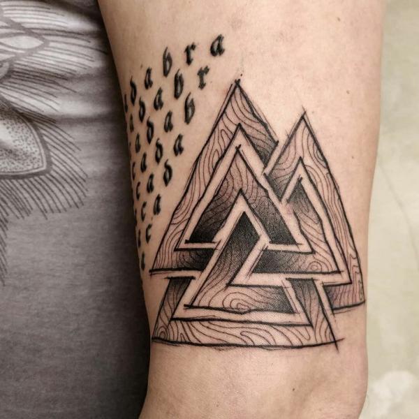 Valknut symbol in wooden texture tattoo