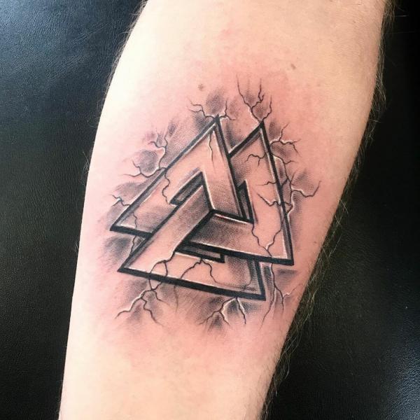 Valknut symbol on cracked skin