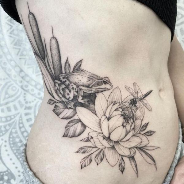 Water lily with dragonfly and frog